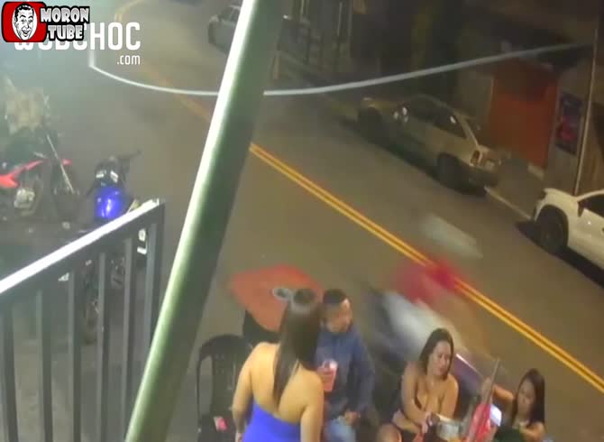 Video :A biker in Brazil strikes a woman who is seated at a pub
